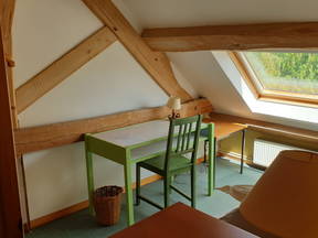 "Australian" bedroom in a restored barn