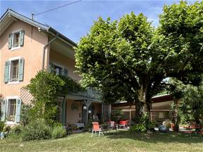 Room with balcony in pretty house with garden